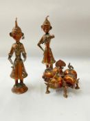 A copper Asian figures of a musicians and a five section Kumkum box surmounted by a bird