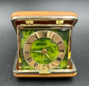 A Coral, made in Japan traveling alarm clock.