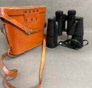 A pair of cased green field binoculars