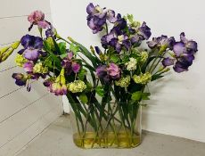 Faux flower arrangement in a glass vase