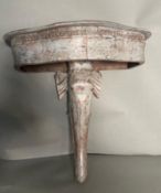 A wooden grey painted wall hanging shelf in the form of an elephant H46cm
