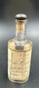 A vintage eau de cologne bottle with a cork stopper