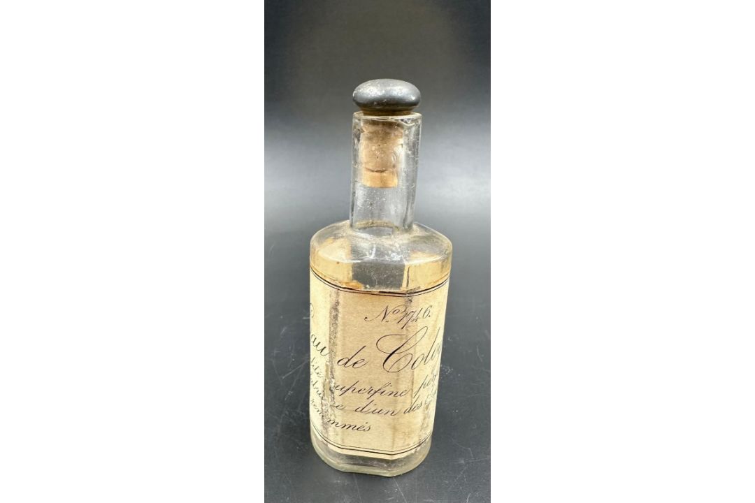 A vintage eau de cologne bottle with a cork stopper - Image 1 of 3