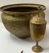 A Middle Eastern brass bowl along with a brass goblet with lid