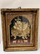 An Indian painted and relief panel depicting Krishna with attendants under an ornate arch,