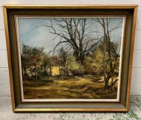 A landscape on canvas signed lower right 74cm x 65cm