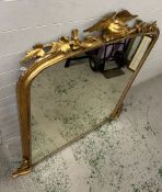 A gilt frame large mantel or hall mirror, carved eagle with oak leaves sits upon an arch top and oak