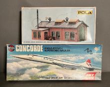 An Airfix model kit of Concorde and a Pola kit of an industrial building