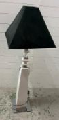 An Obelisk style floor standing lamp