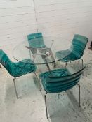 L'eau chairs, metal frame and transparent wave technopoymer shell seat with a glass dining table
