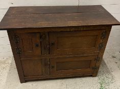 An oak two plank side cupboard (H77cm W105cm D46cm)