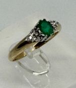 A 9ct gold emerald and diamond style ring, approximate weight 2g and size N.