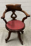 A Victorian revolving chair with cane seat AF