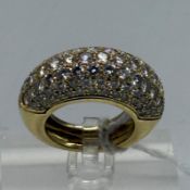 A diamond set domed ring of hollow construction, set with ninety three round brilliant cut diamonds,