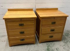 A pair of bedside cabinets with drawers (H73cm W61cm D47cm)