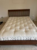A mahogany slatted double bed frame with mattress (W158cm)
