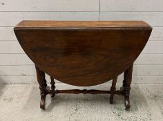 An 19th Century Victorian Sutherland table with ceramic castors (H71cm W118cm D89cm)