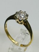 A diamond ring on 18ct gold setting with approximate 1ct central diamond. Approximate size L and