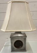 A pewter table lamp