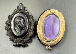 Two mourning brooches one with purple velvet interior