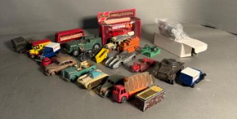 A quantity of play worn Diecast and plastic toy vehicles, various makers and conditions