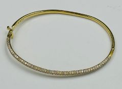 An 18ct gold Christening style bracelet with pave diamond decoration to one side, approximate weight