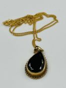 A 9ct fine necklace with pear shaped pendant and approximate weight of 5.7g
