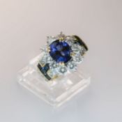 A Contemporary Sapphire , diamond oval cluster ring. Central stone approximate 4.10ct Burma origin