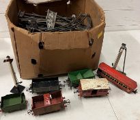 A vintage tin plate, railway including tracks and trains