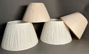 Two sets of cream pleated lamp shades