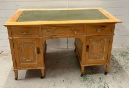 A light oak desk with leather top (H77cm W166cm D60cm)