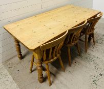 A pine farmhouse table with three chairs (H78cm W183cm D86cm)