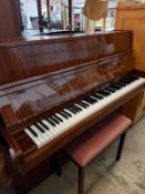 A Petrof upright piano, polish mahogany (H115cm W140cm D54cm)