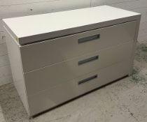 A white gloss chest of drawers with swing out top (H76cm W125cm D55cm)