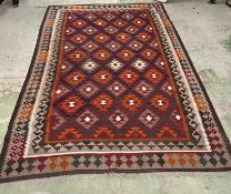 A handmade rug 305cm x 205cm
