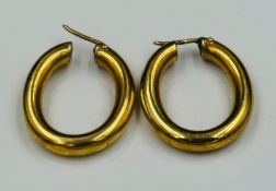 A pair of 18ct gold, marked 750, hoop earrings with an approximate weight of 7.4g