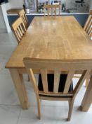 A contemporary pine kitchen table and six faux black leather dining chairs (H76cm W1841cm D89cm)