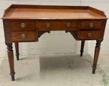 A ladies Victorian writing desk with galleried top over an arrangement of drawers, knee hole