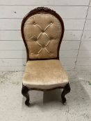 A button back slipper chair