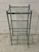 A glass and chrome bathroom unit (H70cm W35cm D28cm)