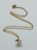 A 9ct gold fine necklace and pendant, approximate weight 1.6g