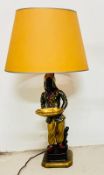 A Blackmore lamp of a female holding a tray on a square base