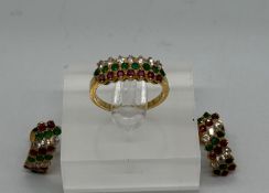 An Arabian jewellery set, marked 22ct gold to include a ring and earrings with sapphires, diamonds