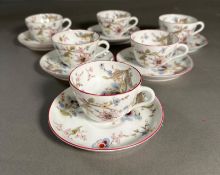 A set of six floral themed tea cups and saucers