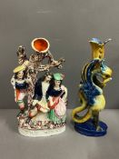 A Staffordshire flatback and Majolica griffin