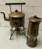 A miners lamps and a brass teapot