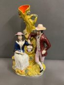 A spill vase of seated lady and gentleman to her right (32cm)