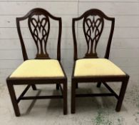 A pair of Georgian style mahogany framed hall chairs