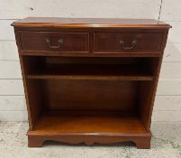 A yew veneered dwarf open library bookcase with two short drawers over (H75cm W77cm D27cm)