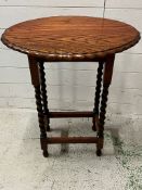 A mahogany side table on barley twist legs (H73cm W58cm)